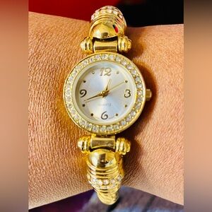 Gold Tone Rhinestone Cuff Rope Watch with Mother of Pearl Face. Size 6 1/2
